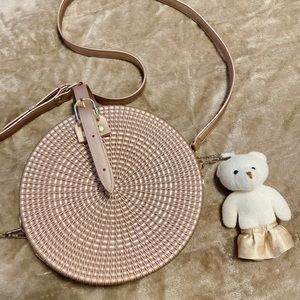 Metallic rose gold circle crossbody bag